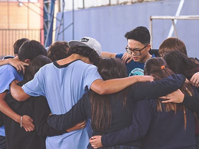 group of students praying